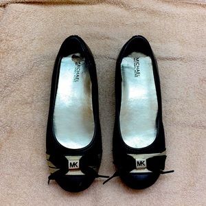 Michael Kors slip on black & gold dress shoes with black bows at toes. Size 3